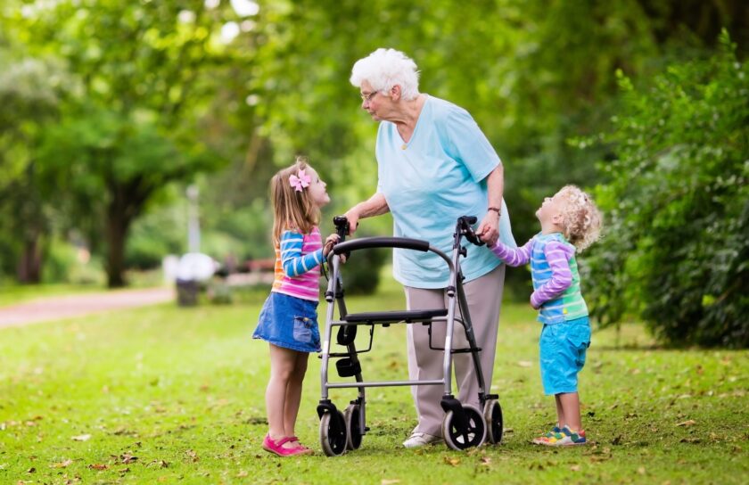 Grandmother with walker playing with two kids